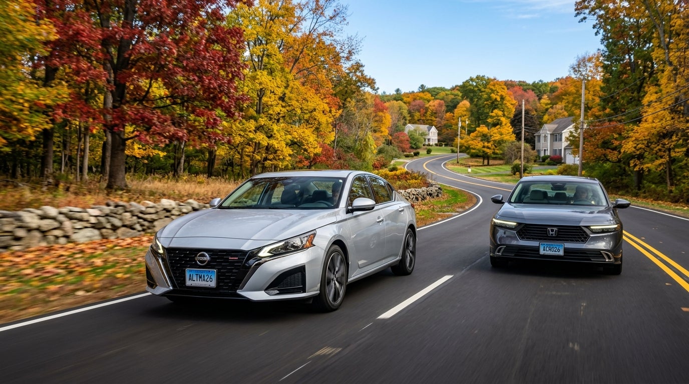 Silver Nissan Altima and grey Honda Accord driving on a winding road surrounded by vibrant autumn trees. (Representative image for illustration purposes only. Actual vehicle may vary based on trim and configuration.)